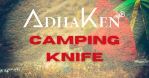 AdhaKen camping knife on a forest floor with campfire, showcasing the best camping knife for outdoor adventures